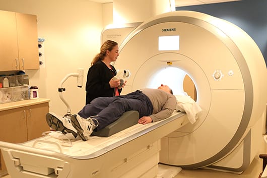 Tech offering patient headphones for MRI